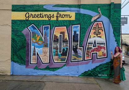 Nikol Allee in front of New Orleans sign