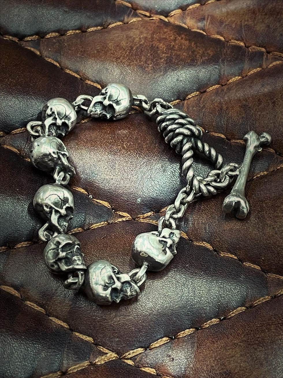 Band of Skulls Silver Bracelet on leather background