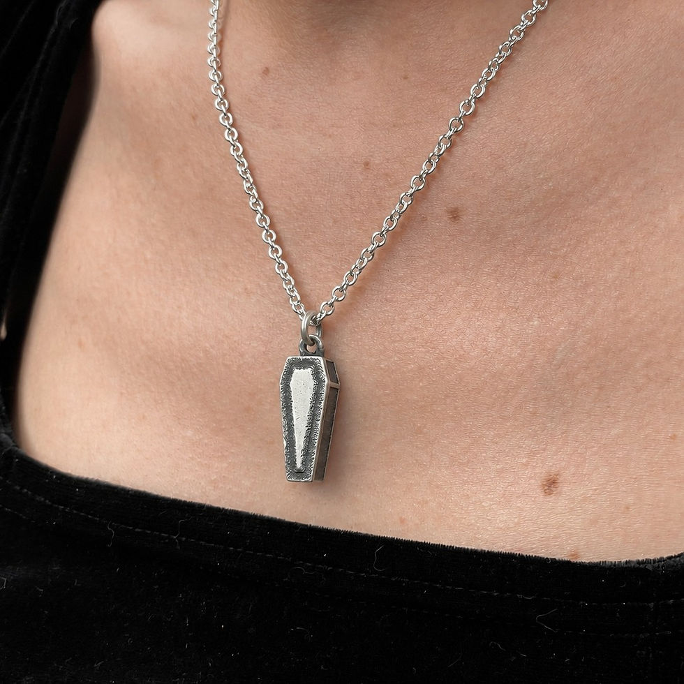 Sterling Silver Coffin Pendant on a woman