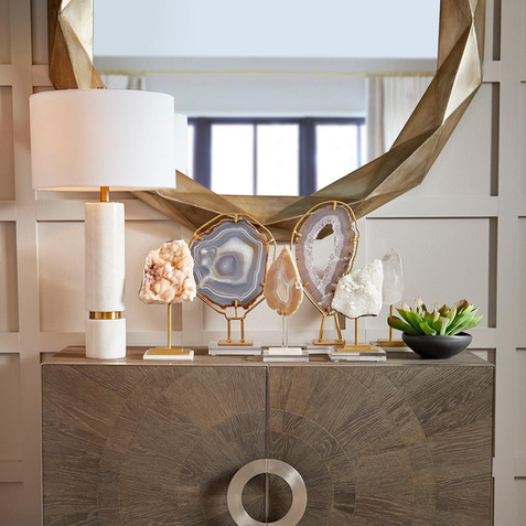 Dimensional round Mirror is elevated in design with a warm silver iron frame and and angles that illuminate. This contemporary design instantly creates a unique focal point in your space.
