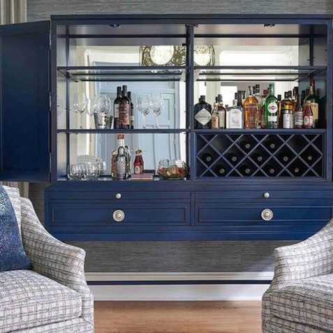 Featuring a blue Amadeus Bar Cabinet.