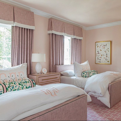 pale pink textured draperies brighen this bedroom