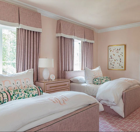 pale pink textured draperies brighen this bedroom
