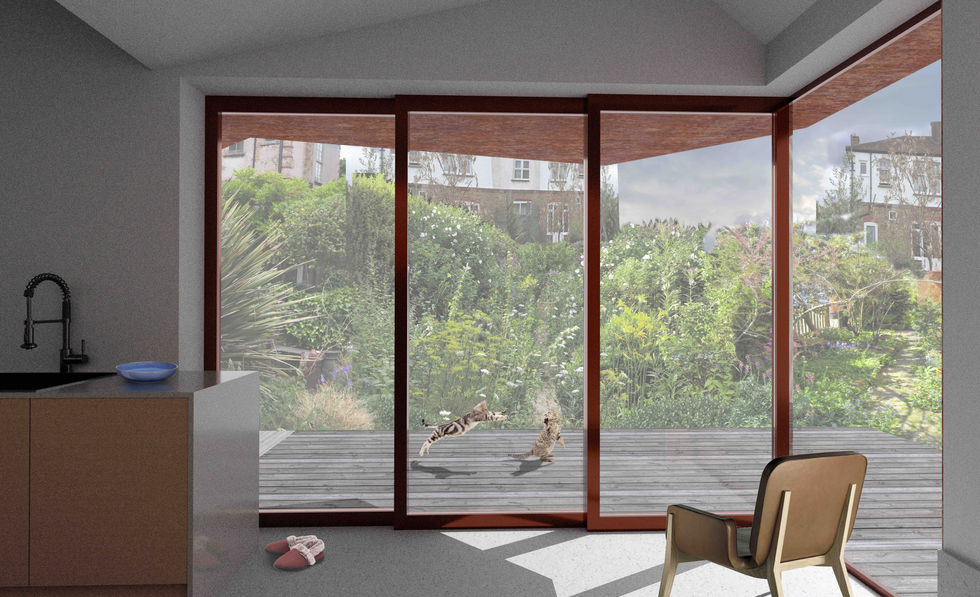 A modern kitchen with a view of a lush garden through large sliding glass doors. Two cats are playing in the garden.