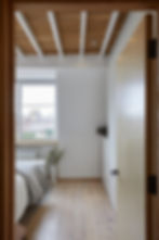 Bedroom with natural colour and material palette