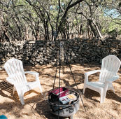 Lazy Lavender Designers Cottage vacation rental in Wimberley Texas front view with outdoor fire pit and s'mores.