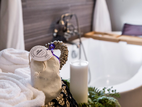 Lazy Lavender House Vacation Rental Bathroom in Wimberley, Texas with large large tub and Lavender bath salt.