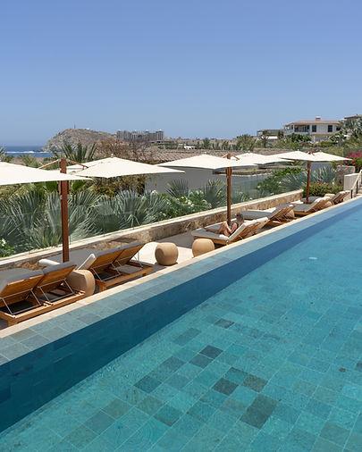 Oceanview spa pool at Four Seasons Cabo Del Sol with lounge chairs overlooking the resort.