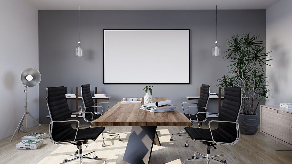 Sleek meeting room featuring black chairs, wooden table, and a blank screen, ideal for business settings.