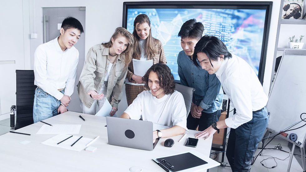 team working around a computer