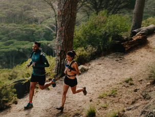 Couple running on mountain trail