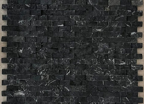 Nero Afyon Split Face is a textured black marble with striking white veining and a rugged surface. Its 3D effect makes it perfect for feature walls and exterior facades, offering a dramatic, natural look.