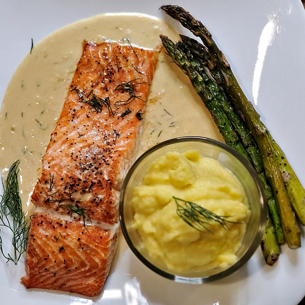 Cedar Planked Grilled Steelhead Trout with Creamy Dijon Dill Garlic Sauce.