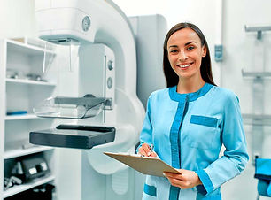 female-doctor-with-patient-card-standing-near-the-mammography-apparatus.jpg