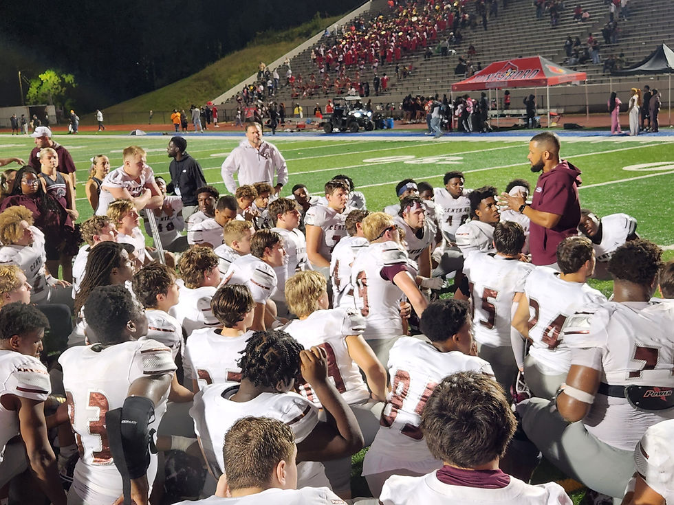 Central head coach Umbrah Brown talks to team following 24-21 win over Jonesboro