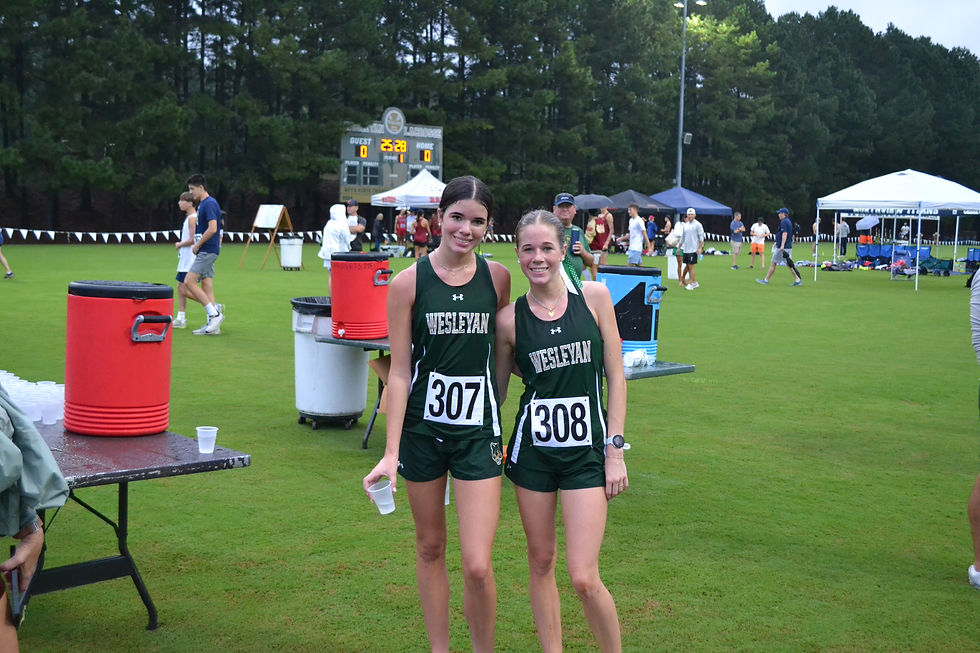 Wesleyan's Margaret Moore (L) and Weezie Moore (R) after the girls 5000 yards race