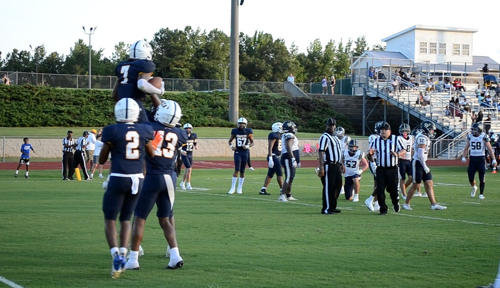 Eagle's Landing Christian Academy celebrate after touchdown score against Whitefield Academy in scrimmage