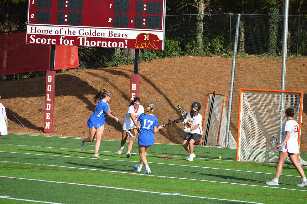Campbell's Lila Marble #4 shoots against Holy Innocents goalie Sophia Ocampo #19