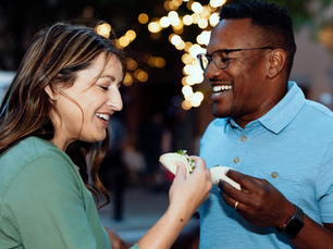 A couple eating tacos