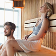 Woman and man in a sauna