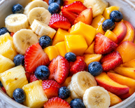 freshly sliced seasonal fruit, bowl of fruit