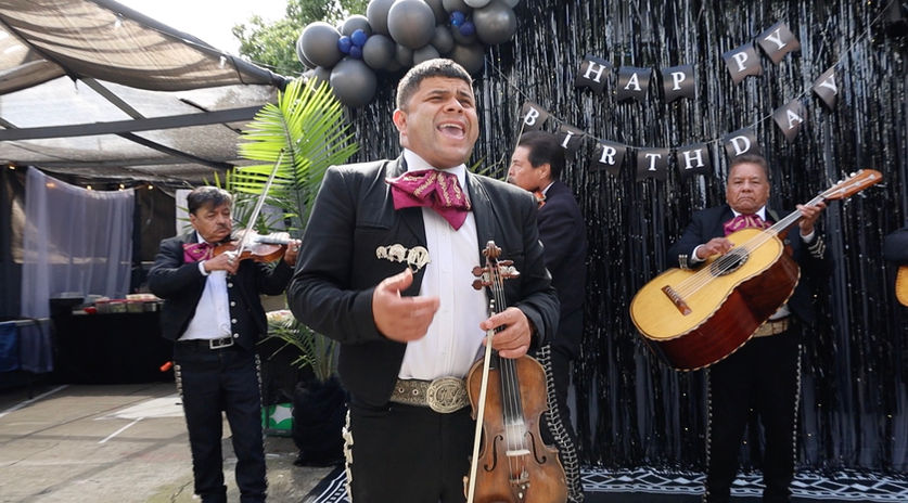 Mariachi México Lindo performing live at a birthday celebration featuring traditional Mexican songs and mariachi entertainment.