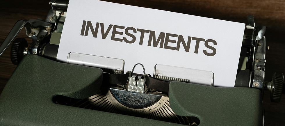 INVESTMENTS written on a white paper in a typewriter
