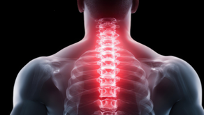 A glowing red spine is highlighted in an X-ray on a person's back against a black background, suggesting pain or medical focus.