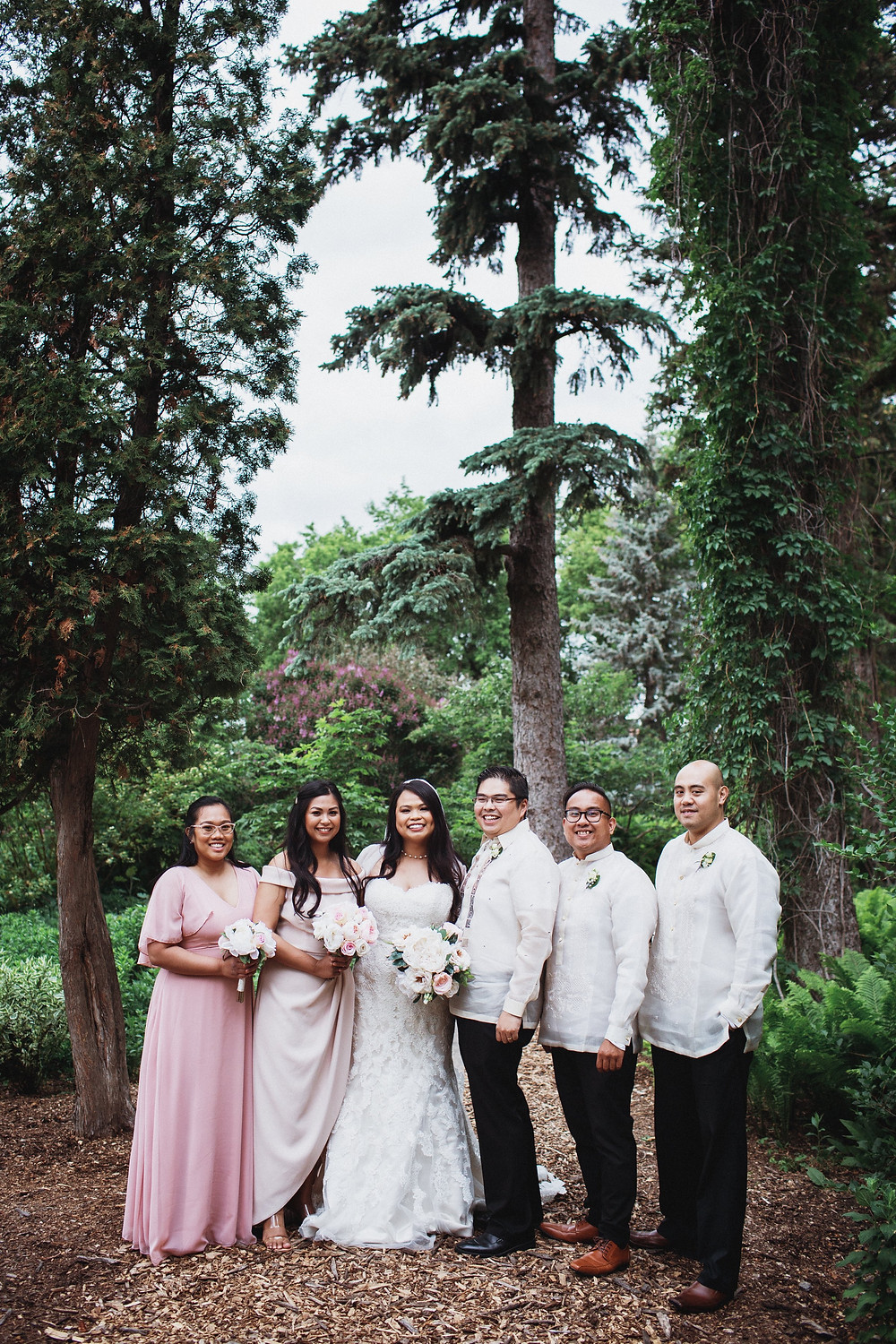 Bridal Party poses in the English Gardens in Assiniboine Park, Winnipeg, Manitoba.