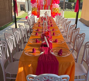 long table with various linen on display