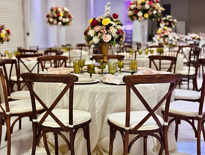 tables and chairs set for dinner service and elegantly decorated