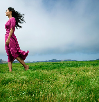 Woman on grassy mountaintop