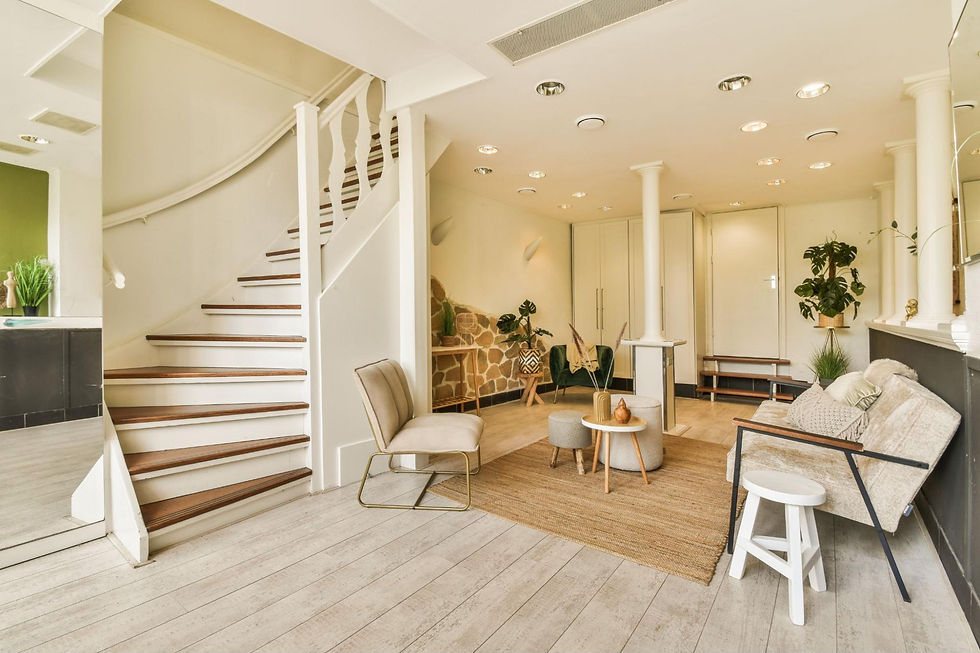 A newly renovated white-themed basement featuring sleek and contemporary furniture.