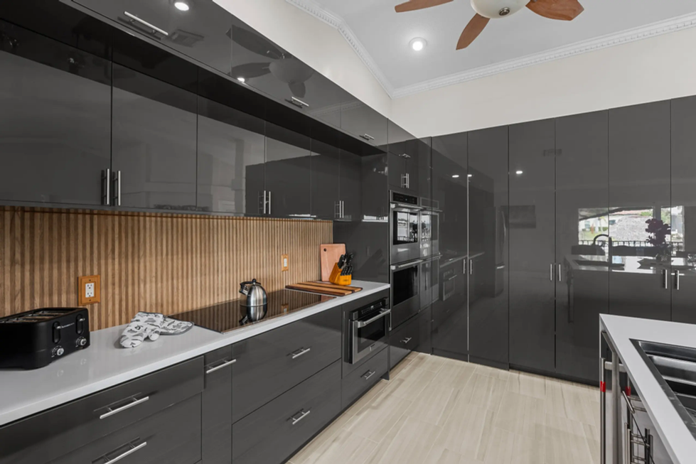 modern kitchen with slate wood-like ceramic tile backsplash