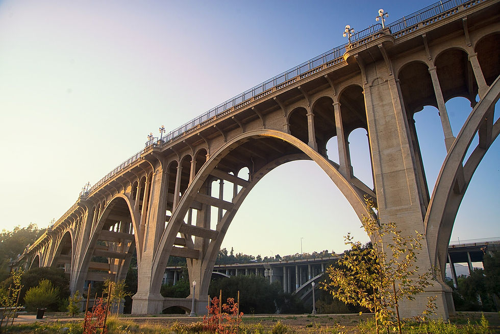 Colorado Street Bridge arching over the Arroyo Seco trails in Pasadena at sunset