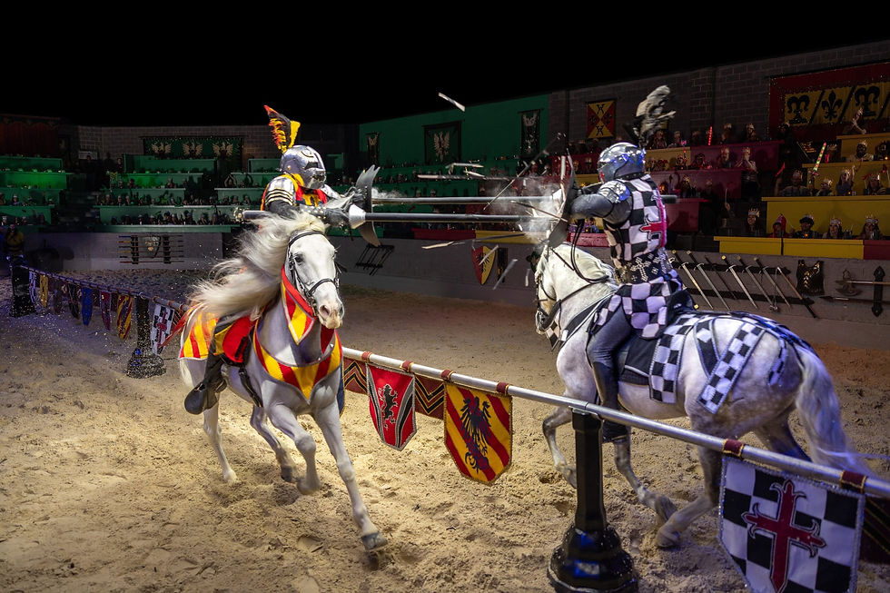 Two knights jousting on horseback in the arena at Medieval Times Dinner & Tournament