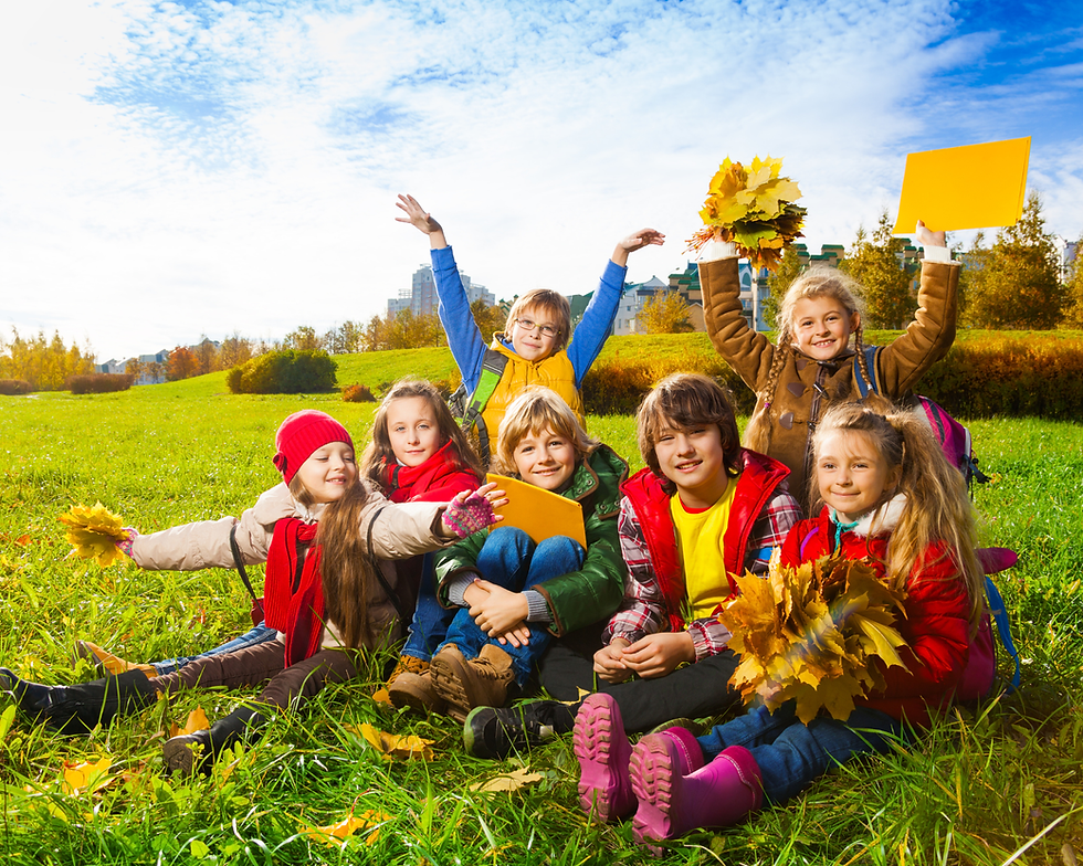 Three young children playing in a pumpkin patch, one of the best things to do with kids in Los Angeles in October