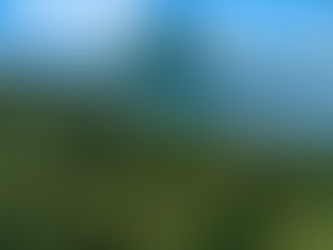 A luxury small-ship cruise anchored in Bora Bora’s turquoise lagoon with Mount Otemanu rising in the background under a golden Tahitian sky.