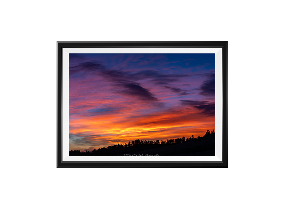 Brush strokes with purple and yellow at sunrise. A romantic sunrise sky ablaze with warm colors