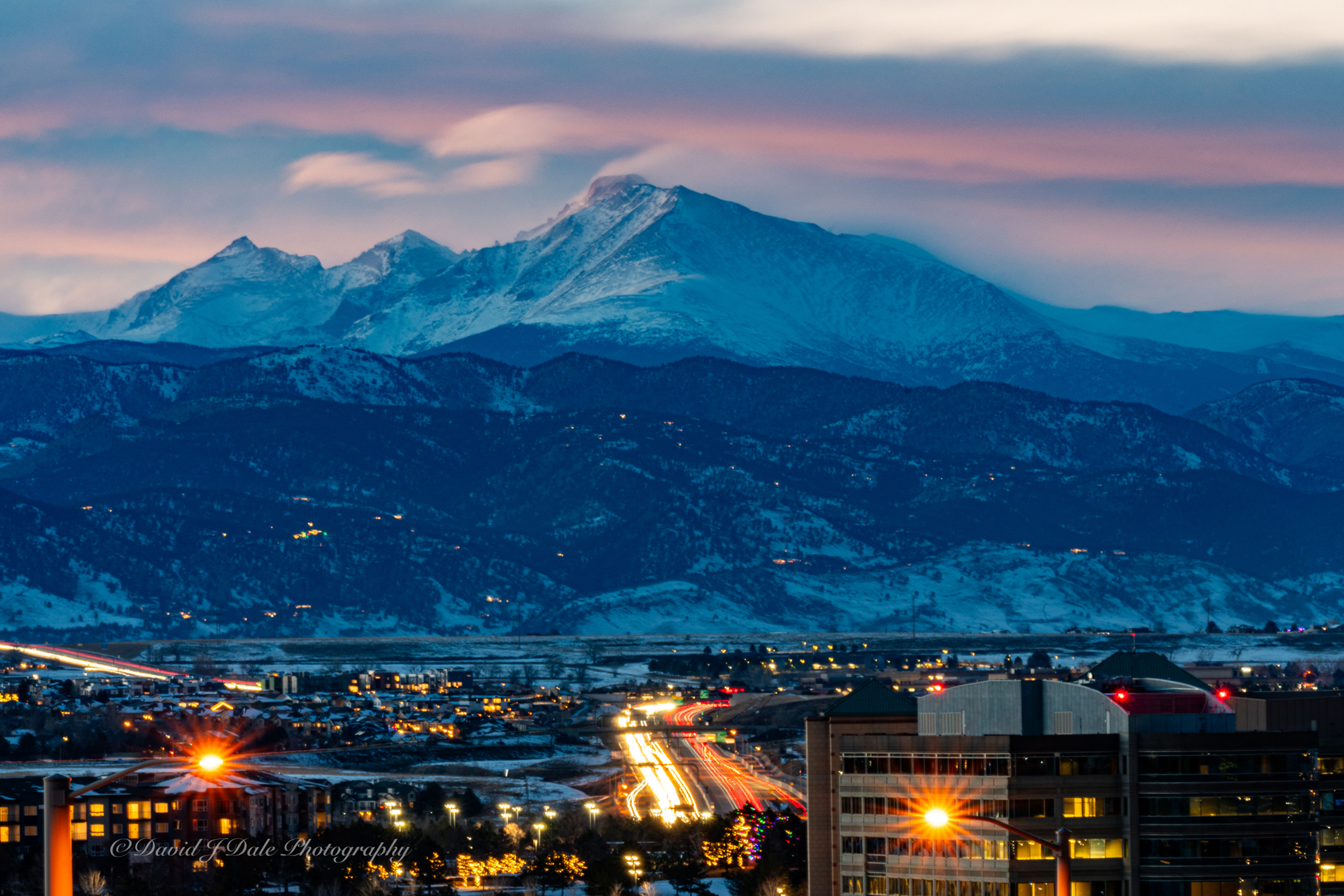 Rocky mountains sunset Boulder Colorado with snow capped mountains holiday scene