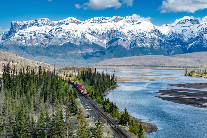 Canadian Rockies and Athabasca River in Jasper National Park with train