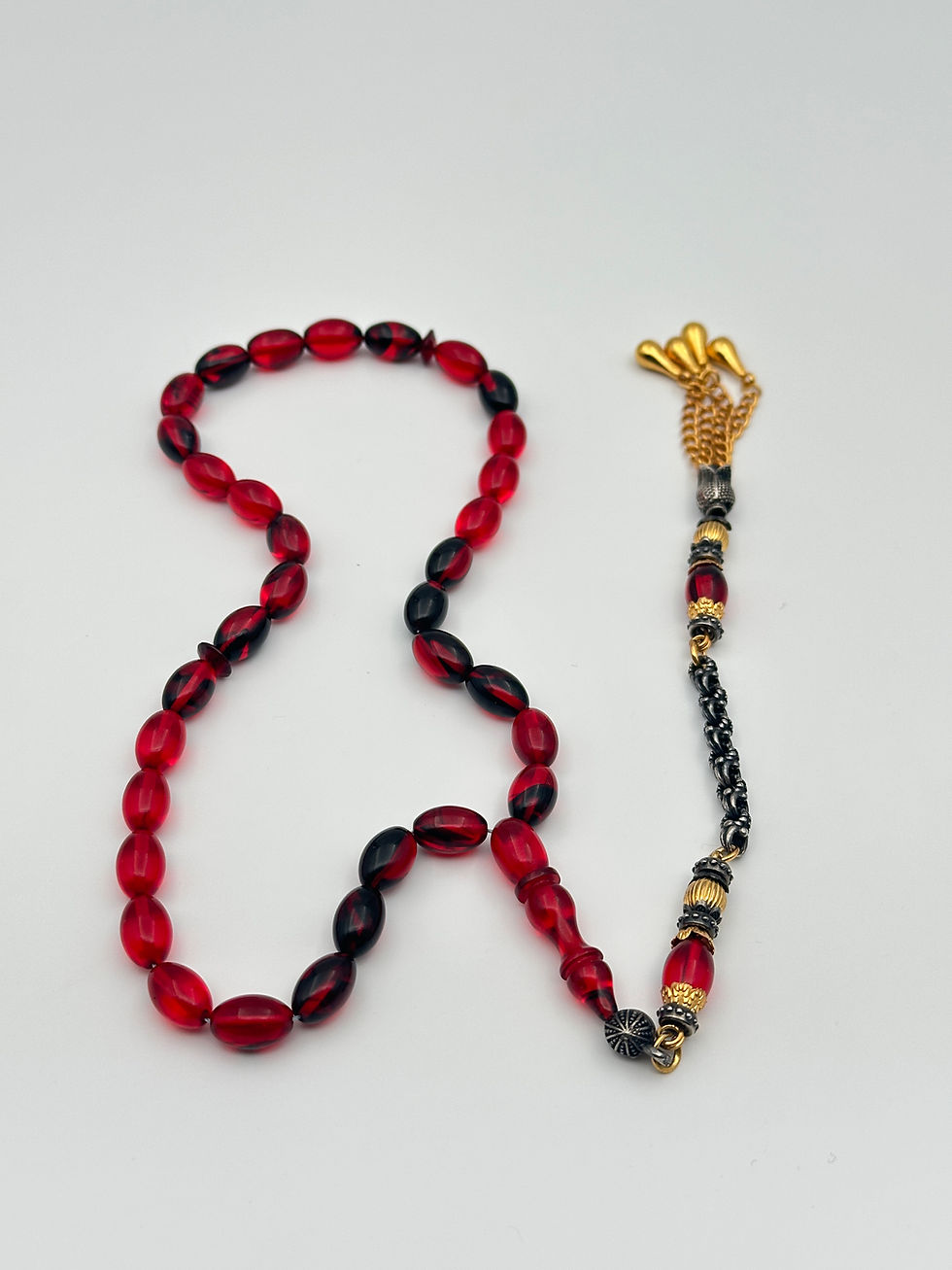 Küçük resim: Fire Amber Tasbih – Red & Black Oval Cut with Custom Tassel