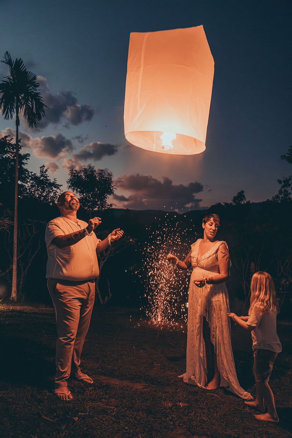 Mum, Dad and son releasing lantern