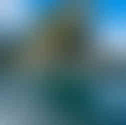 Limestone cliffs coming out of the lake with splashes of water