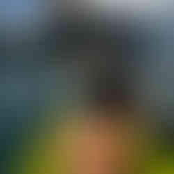 Jax Kayaking on Cheow Lan Lake with limestone cliffs in the background