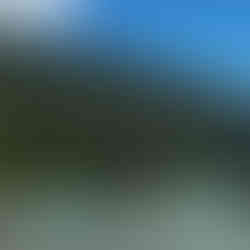 Hills of the Surin Islands with boats in the sea