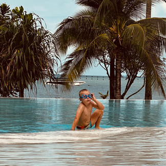 Boy getting out of the swimming pool