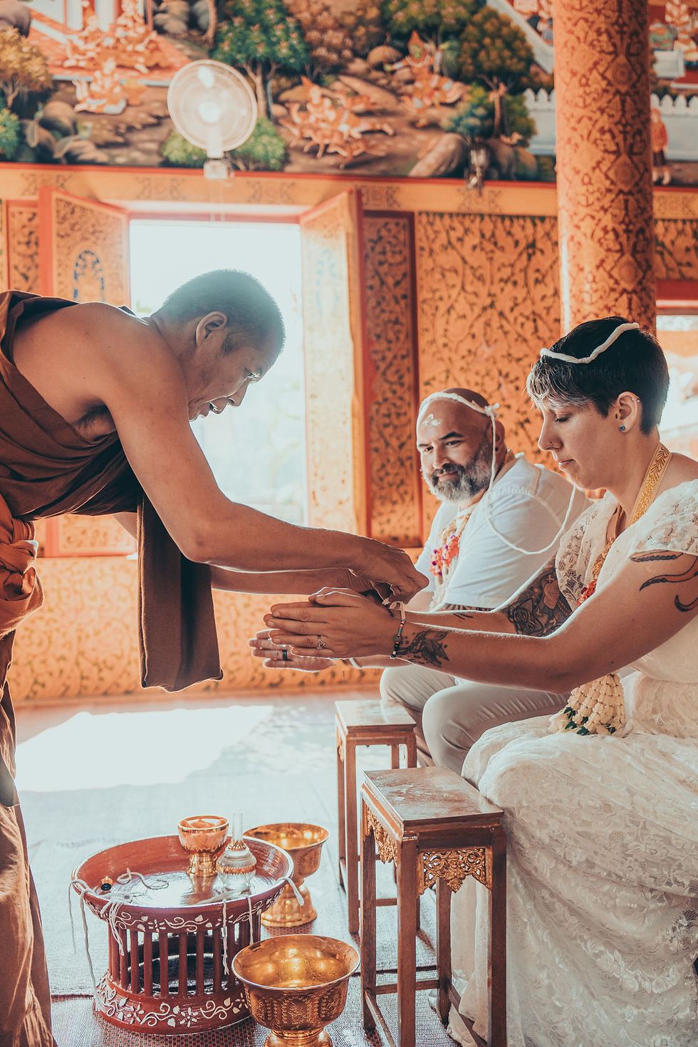 Monk performs Thai water blessing