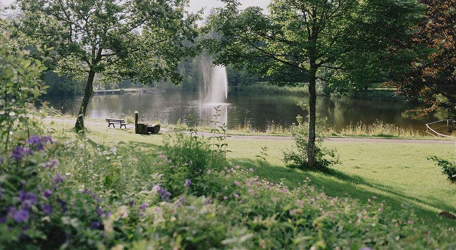 A lake with a fountain in the Waldbad Isny