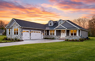 Sunset glow over new ranch home.png